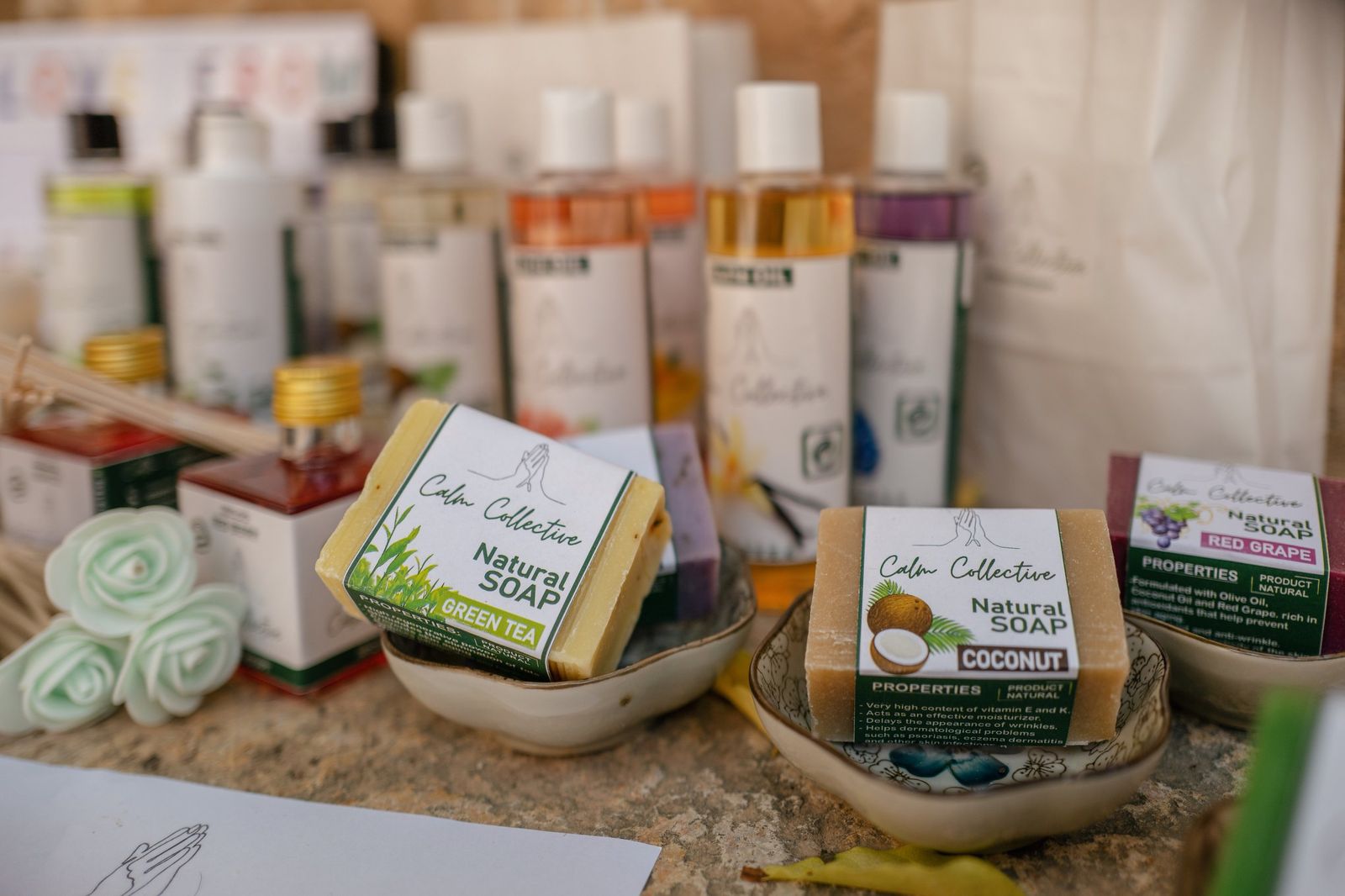 Locally handmade natural soaps on a table at a Calm Collective wellness market in Mallorca