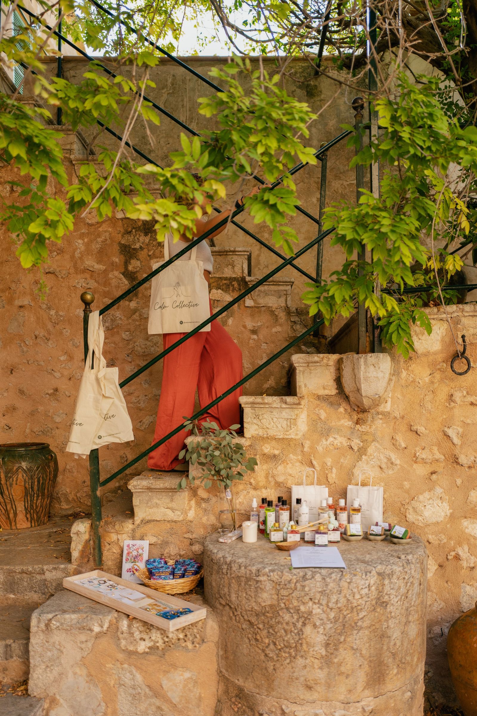 Wellness market stall against a stone finca wall